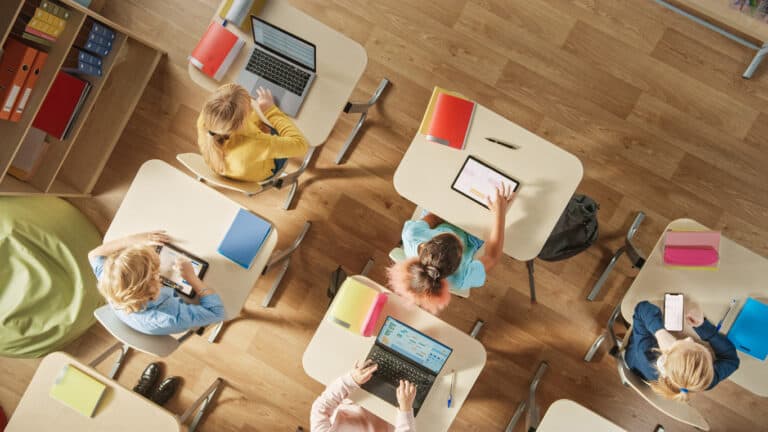 Students in a classroom learning on their computers
