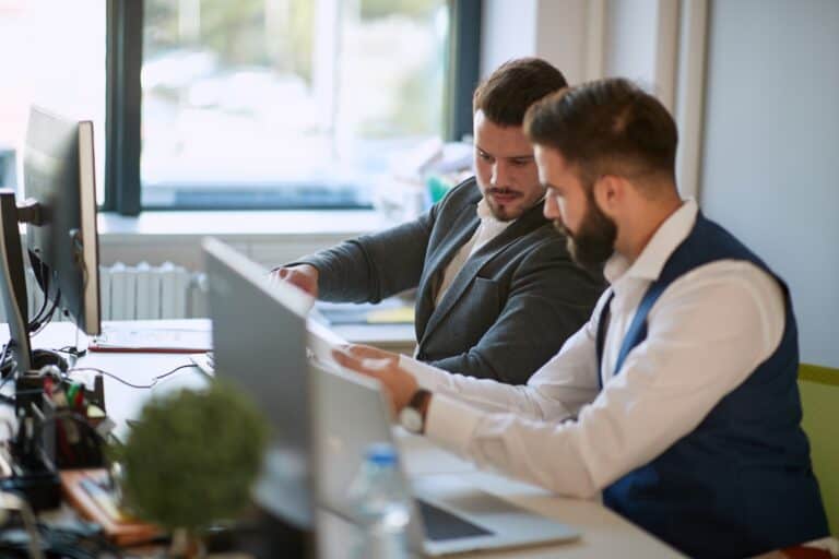 An AIaaS provider shows an SMB owner how to better his business with AI on a computer