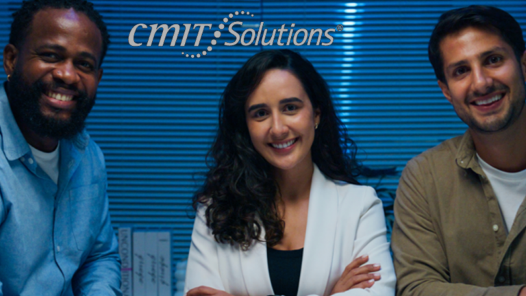Three smiling colleagues pose for a photo in an office, with the CMT Solutions logo in the blue-striped background.