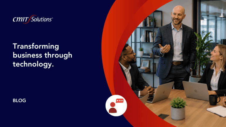 Blog hero image: three professionals in a meeting with laptops, set against a navy left panel featuring the headline “Transforming business through technology.” and red curved graphics on the right.