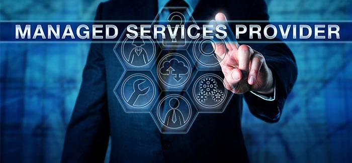 A professional pressing MANAGED SERVICES PROVIDER on an interactive virtual touchscreen illustrates the reasons to hire managed service providers.