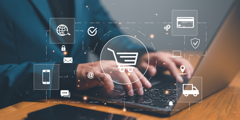 A cybersecurity professional works on a laptop to protect a retail business, symbolized by floating icons of a shopping cart and a credit card.