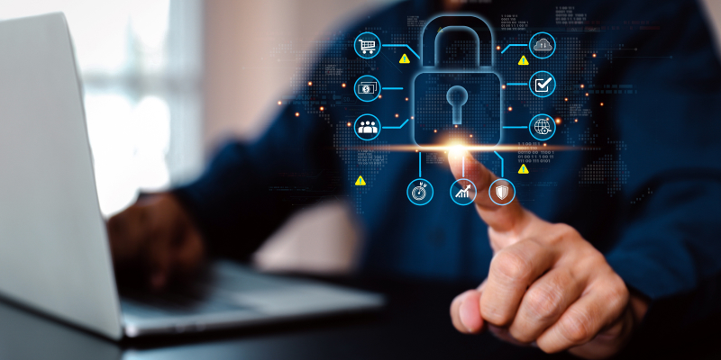 A small business owner accessing a digital portal for enterprise-grade cybersecurity.