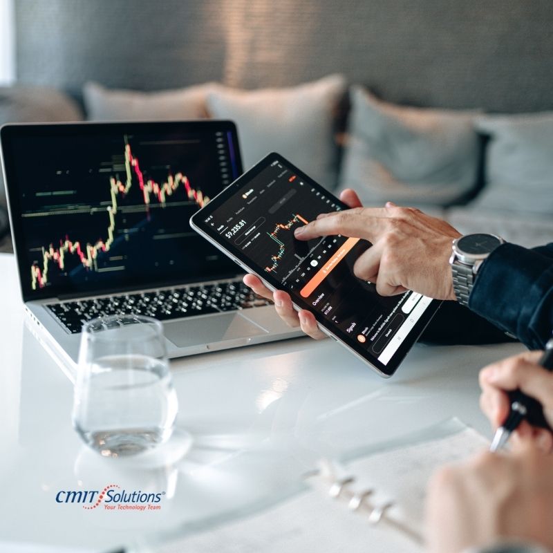 Financial services cybersecurity team reviewing risk dashboard in a bank boardroom