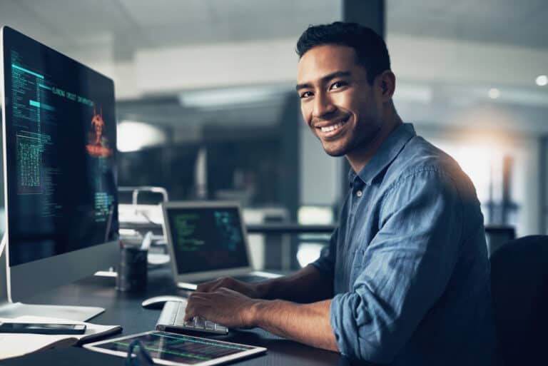IT Professional sitting in front of computer