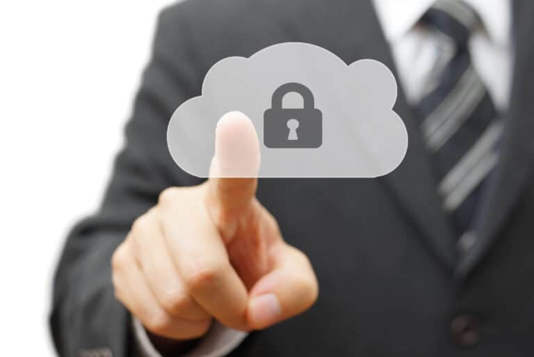 A man in a suit reaches out to touch a cloud logo with a lock on it depicting cloud security