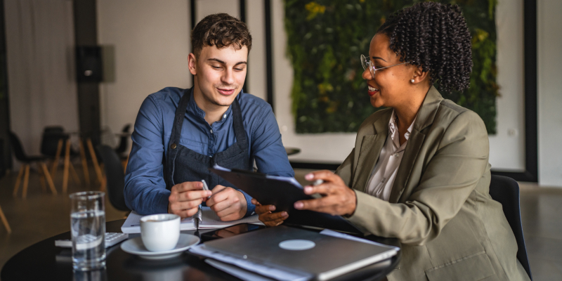 An IT service provider offering guidance to a small business owner highlights the importance of IT roadmap for business growth.