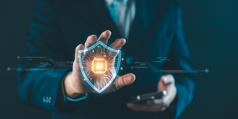 Person holding an AI-labeled shield representing protection and security