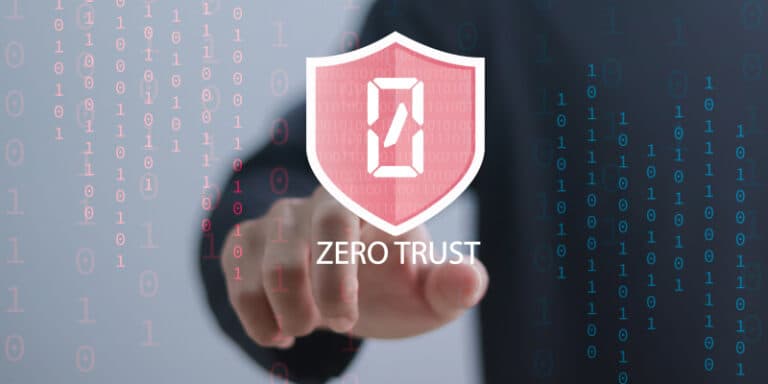Person in a suit points forward, with a pink shield logo reading 'ZERO TRUST' against a blue binary code background.