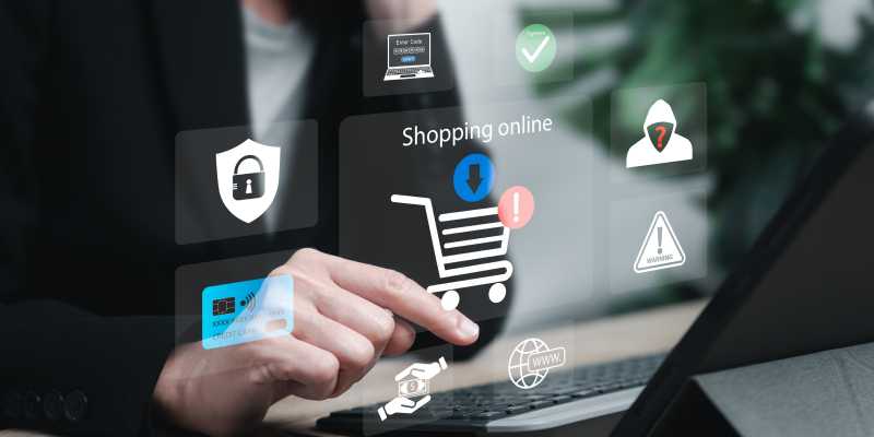 A person using cybersecurity to secure retail e-commerce data on a laptop.