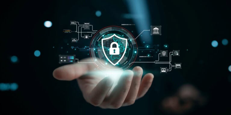 Person holding virtual shield, representing illustrating cybersecurity importance and data protection on internet.