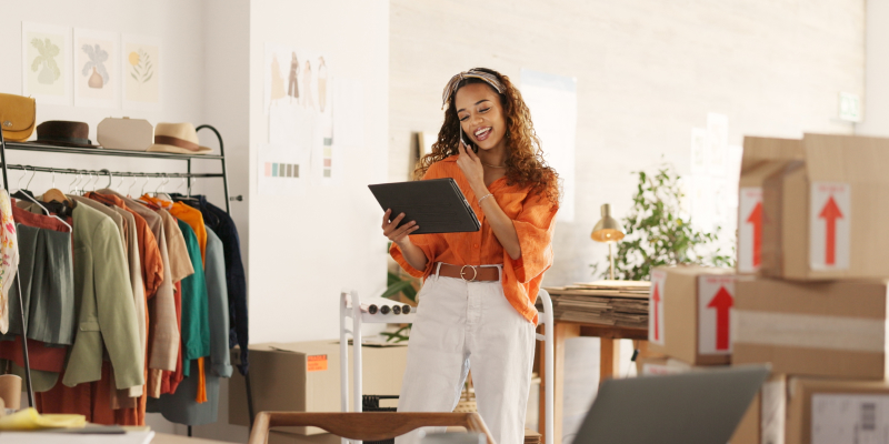 A small business owner receiving assistance from her local IT support team over the phone.
