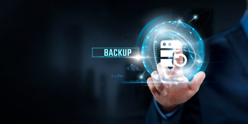 A businessman interacting with a digital backup icon emphasizes the high cost of lacking a data backup strategy.