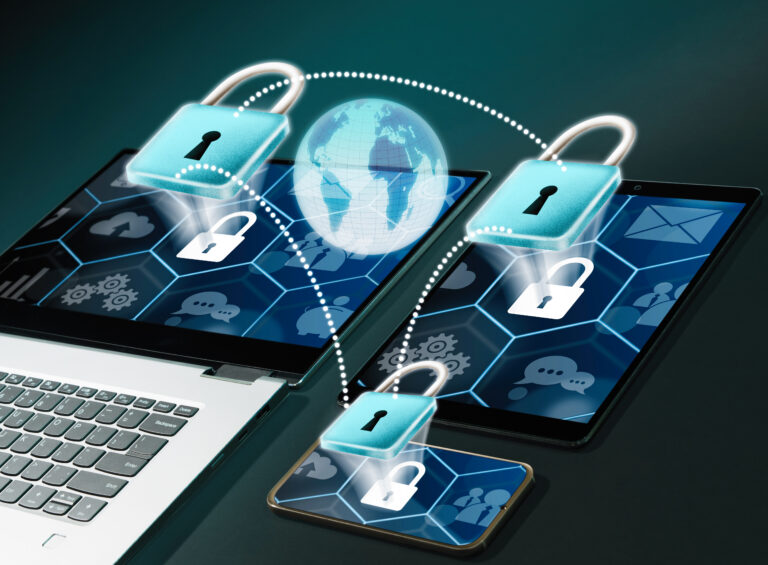 Global cybersecurity concept: interconnected devices (laptop, tablets, smartphones) with locks around a glowing globe.