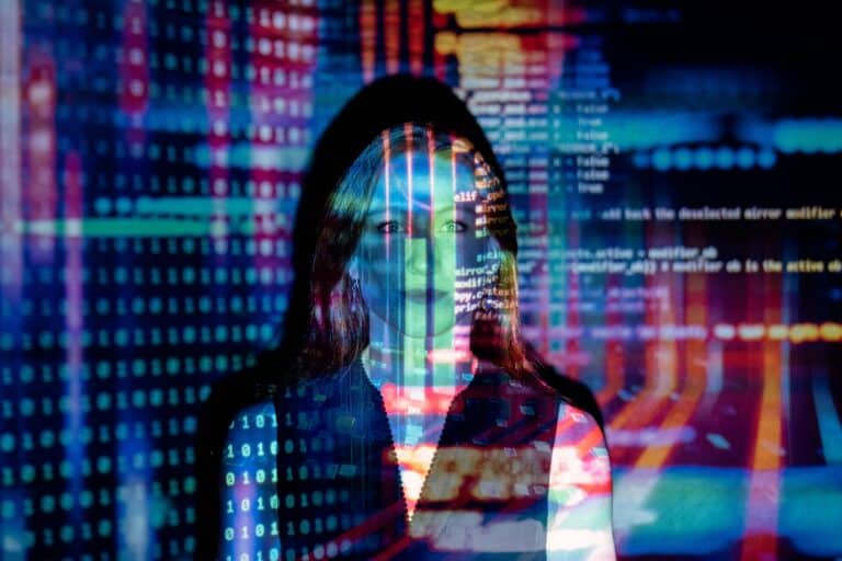 Code is projected over a female employee symbolizing data migration.