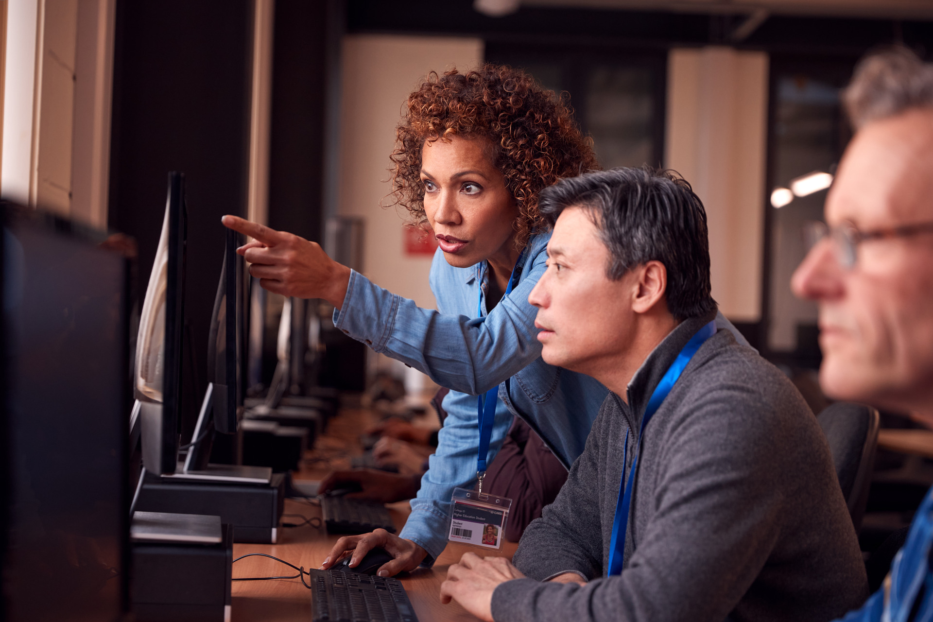it expert with group of workers in front of computer