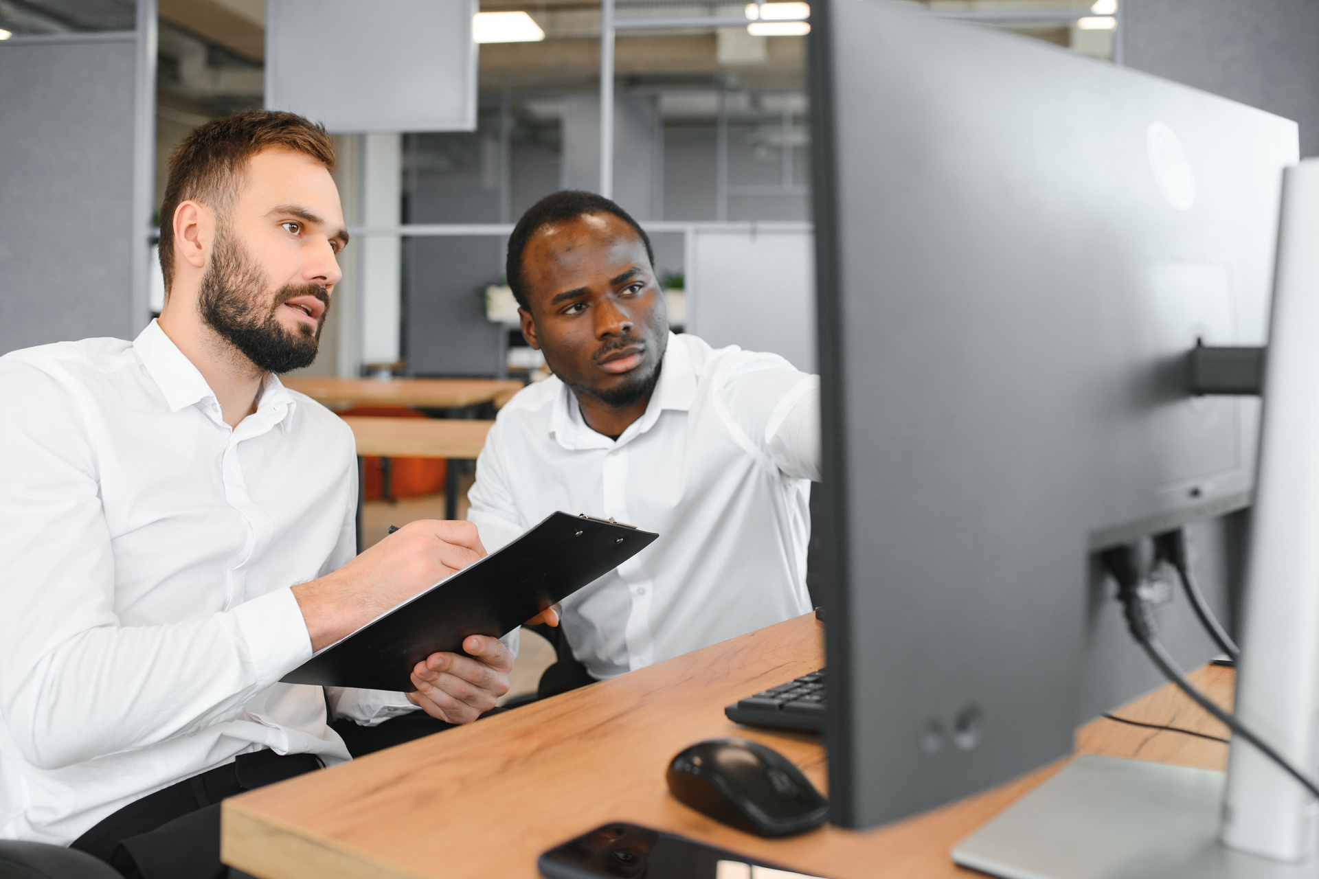 two it experts working on computer