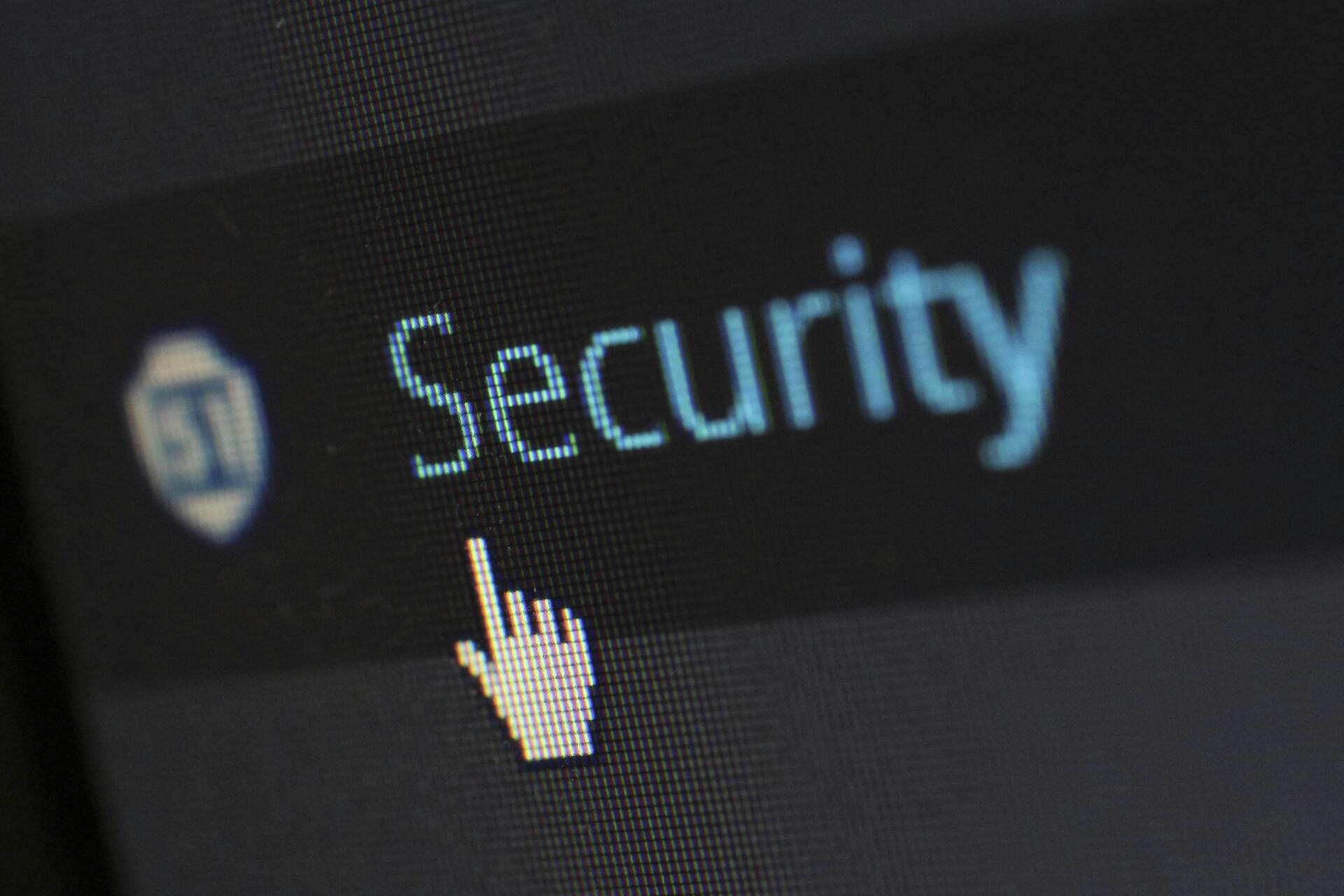 Close-up of a screen with the word Security and a pointer cursor