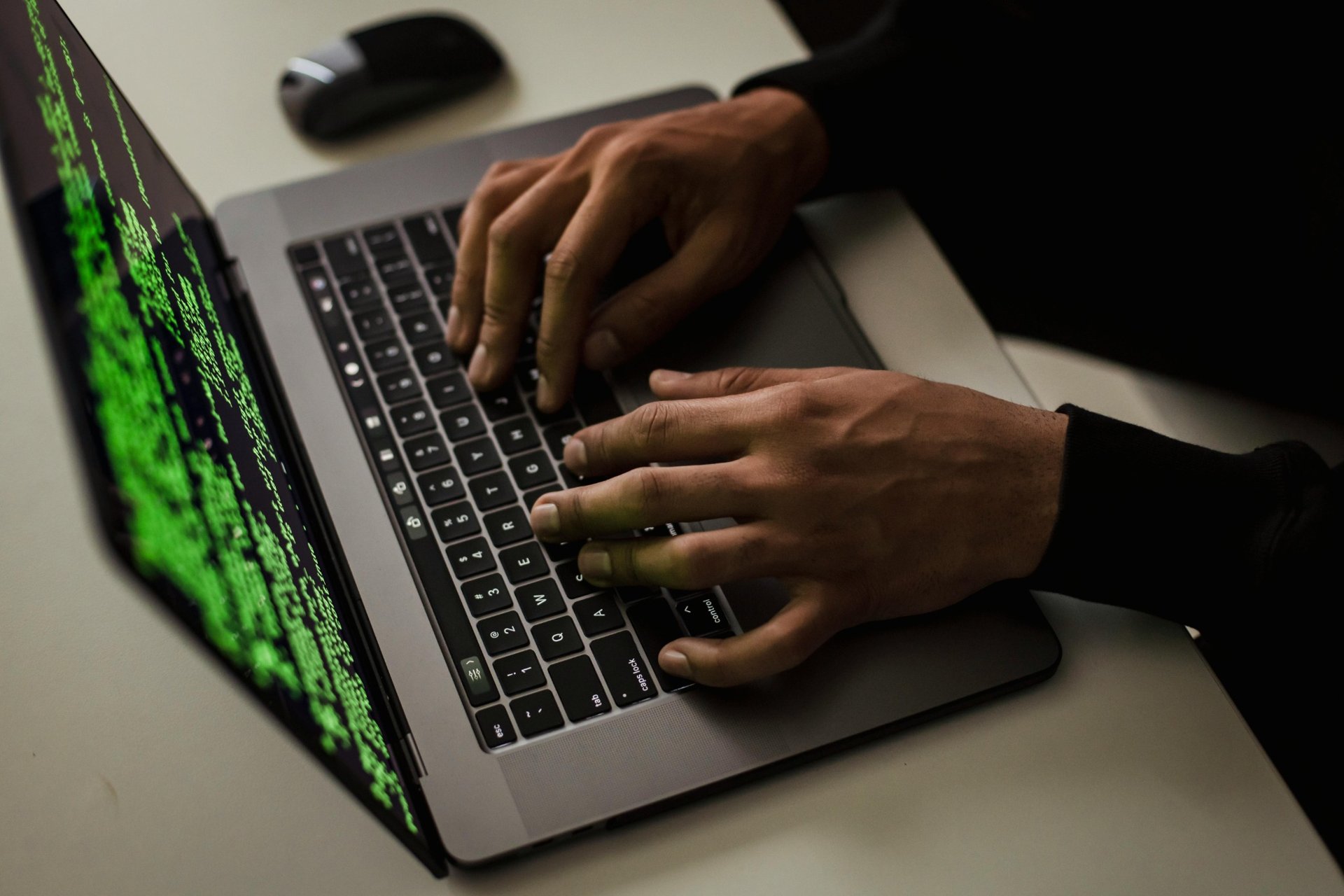 Close-up of hands typing with a legal-themed document open