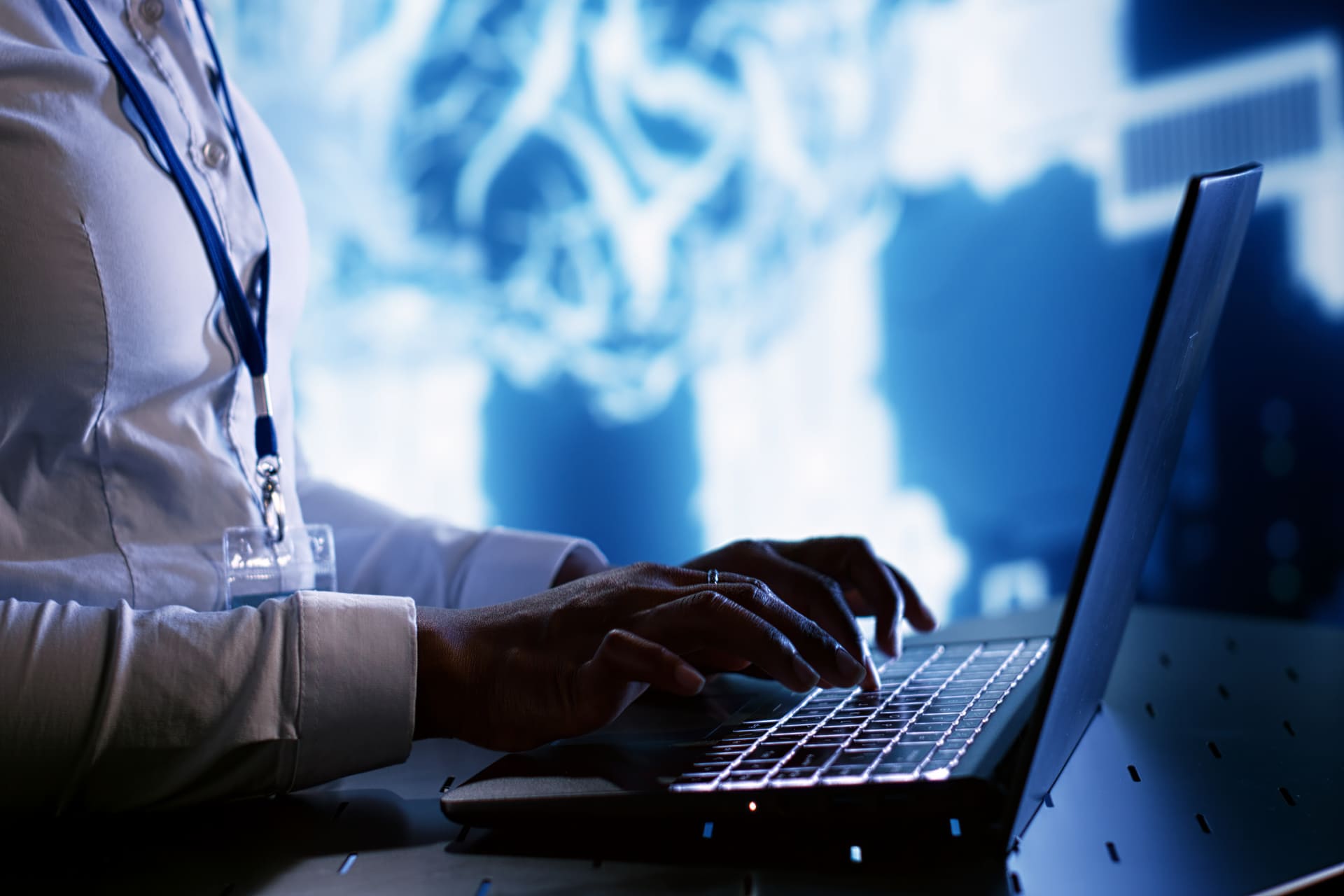 Close-up of woman typing with AI interface in background