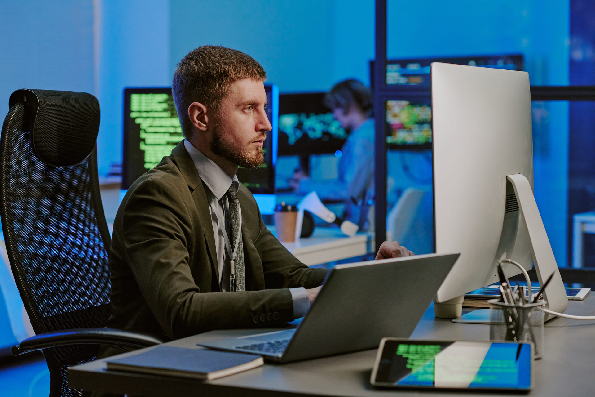 Male specialist working on computer in cybersecurity office