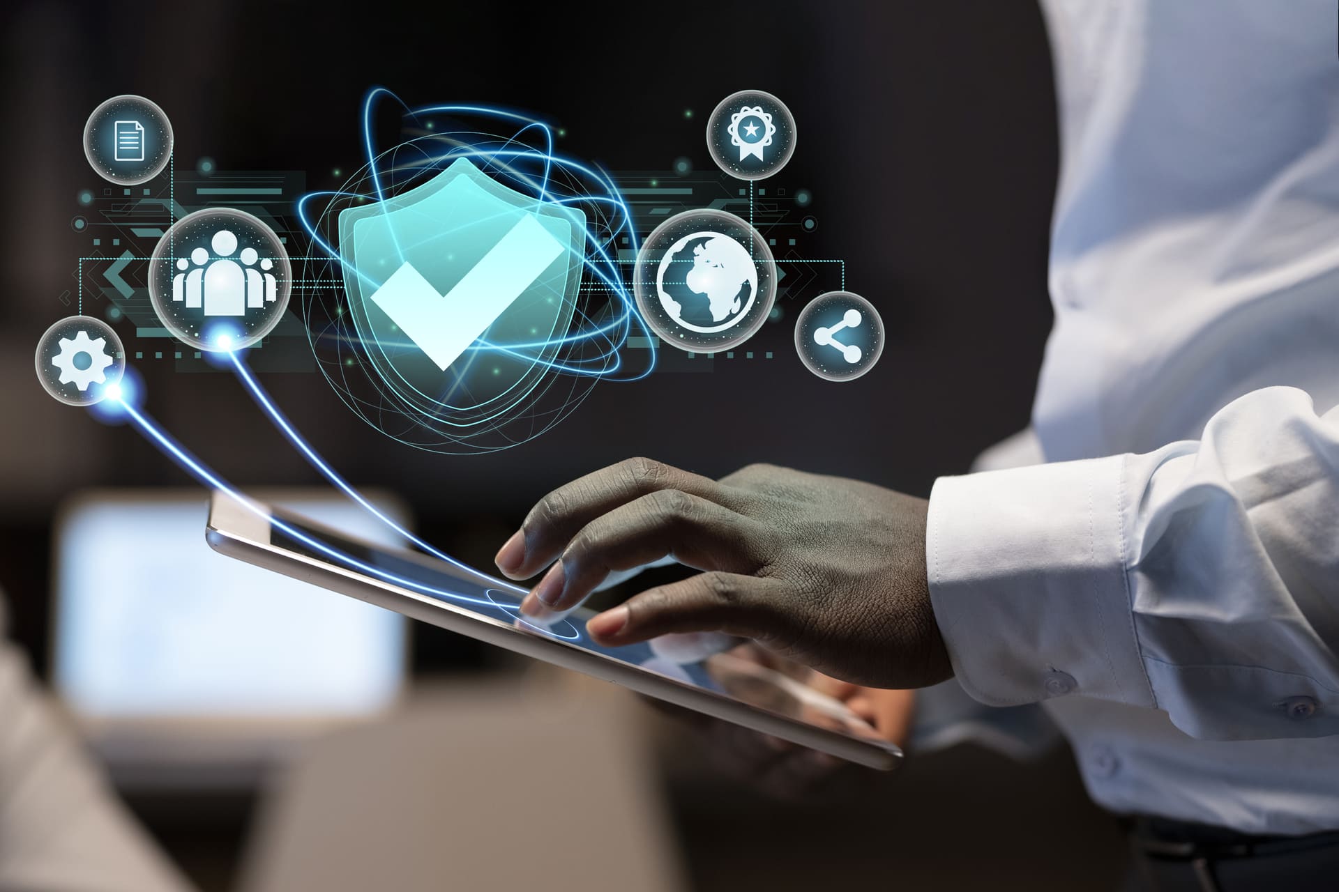 Man using tablet with digital icons