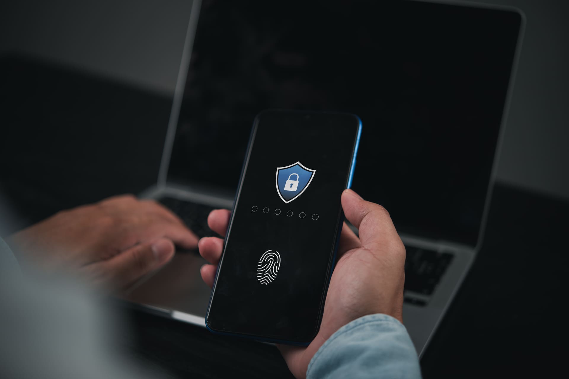 User unlocking smartphone with fingerprint for two-factor authentication | CMIT Solutions User unlocking smartphone with fingerprint for two-factor authentication
