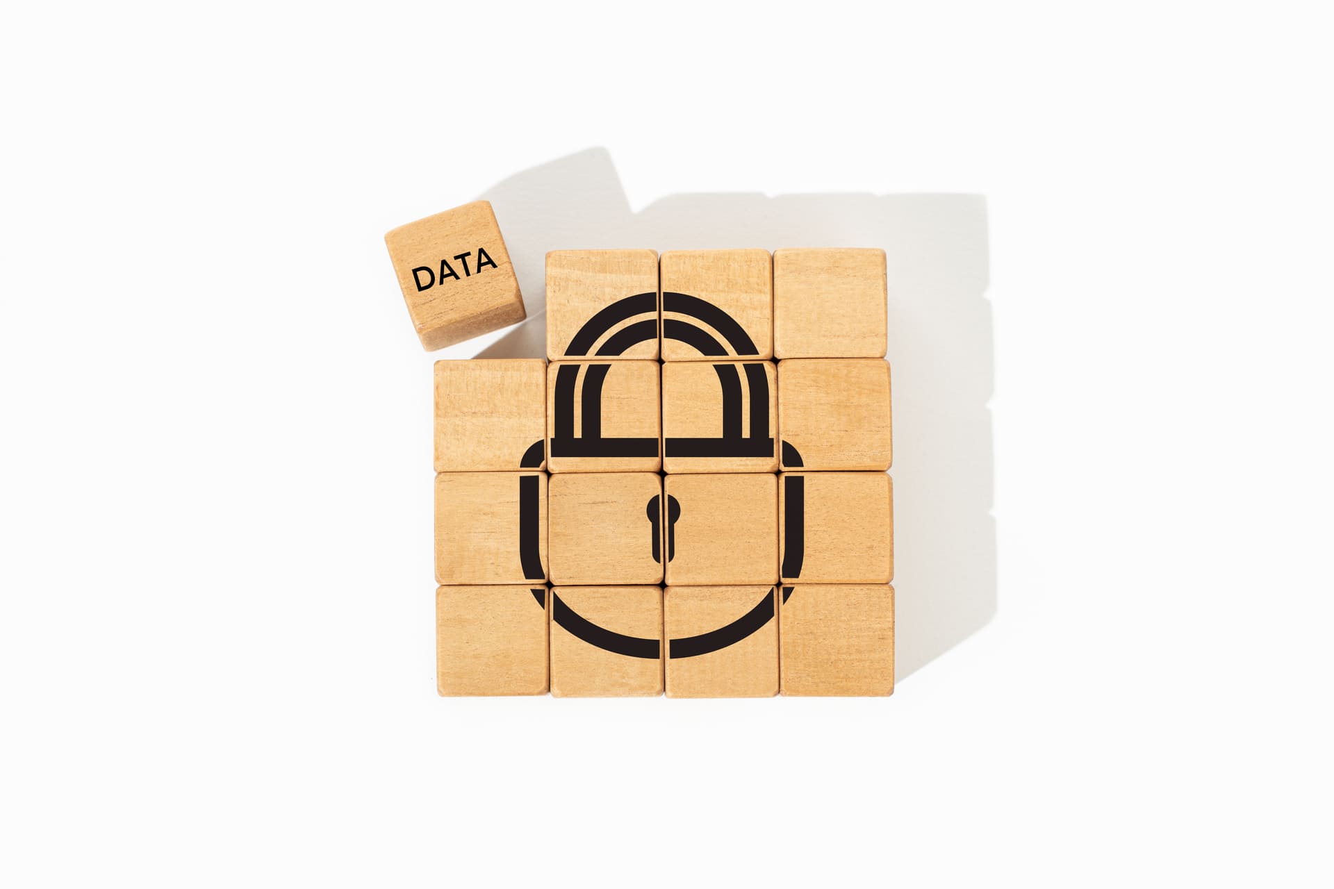 Wooden cubes forming padlock graphic symbolizing data security