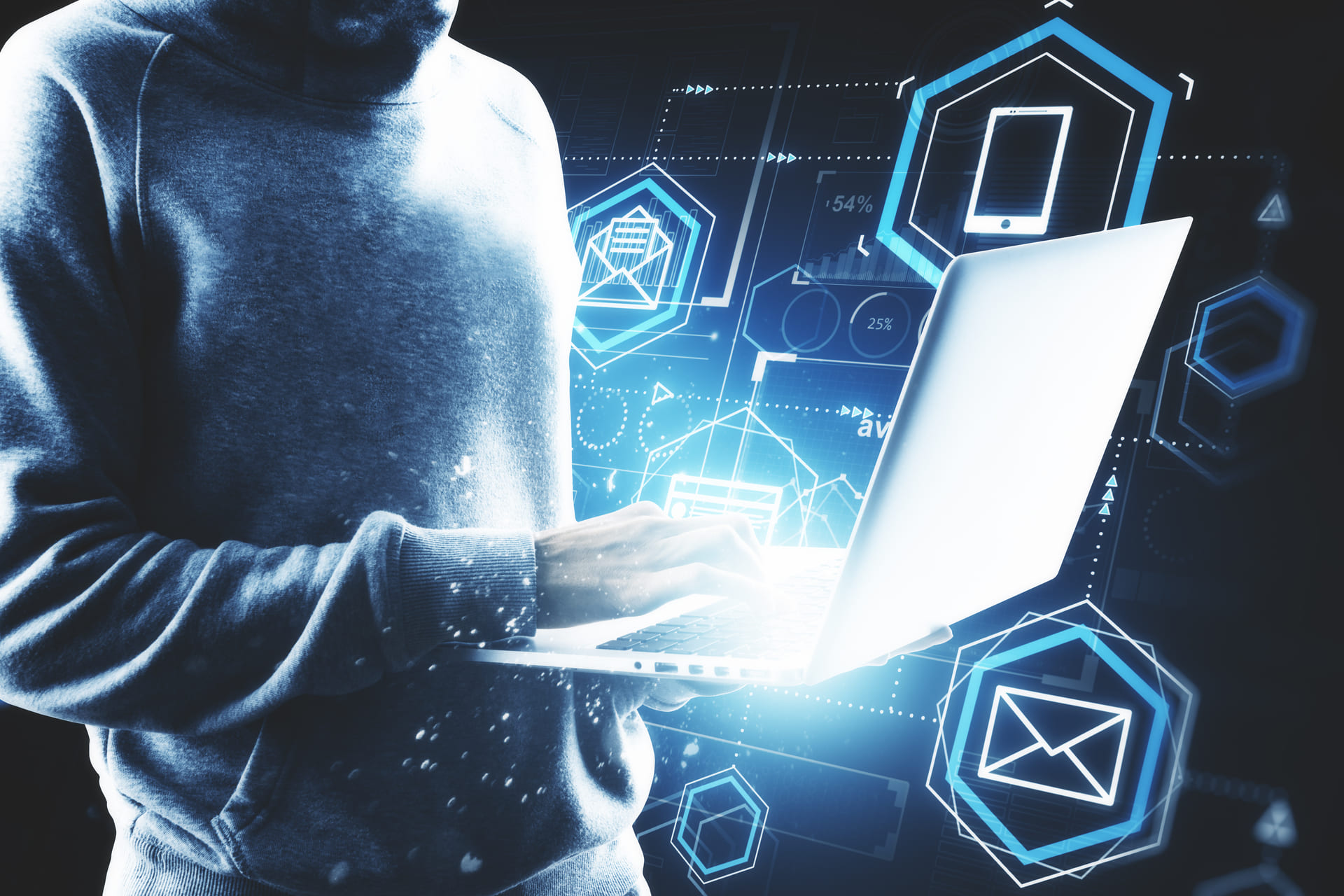 Person using laptop with digital cybersecurity graphics overlay