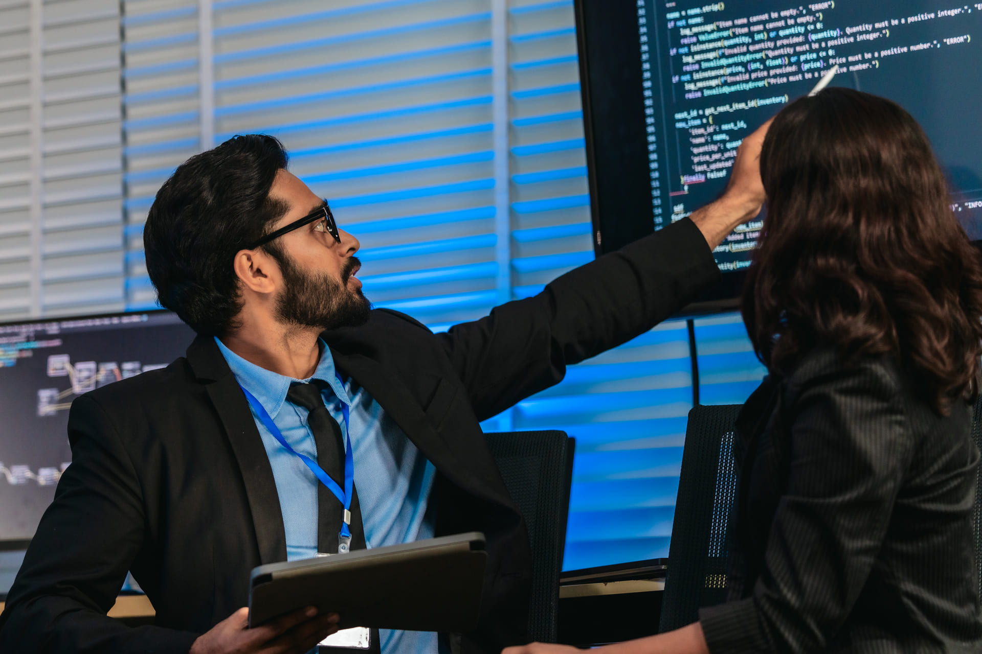 software-developers-discussing-code | CMIT Solutions software-developers-discussing-code