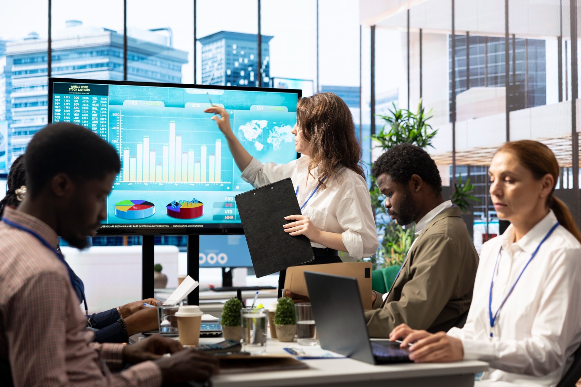 business-team-presenting-data-analytics-large-screen | CMIT Solutions business-team-presenting-data-analytics-large-screen