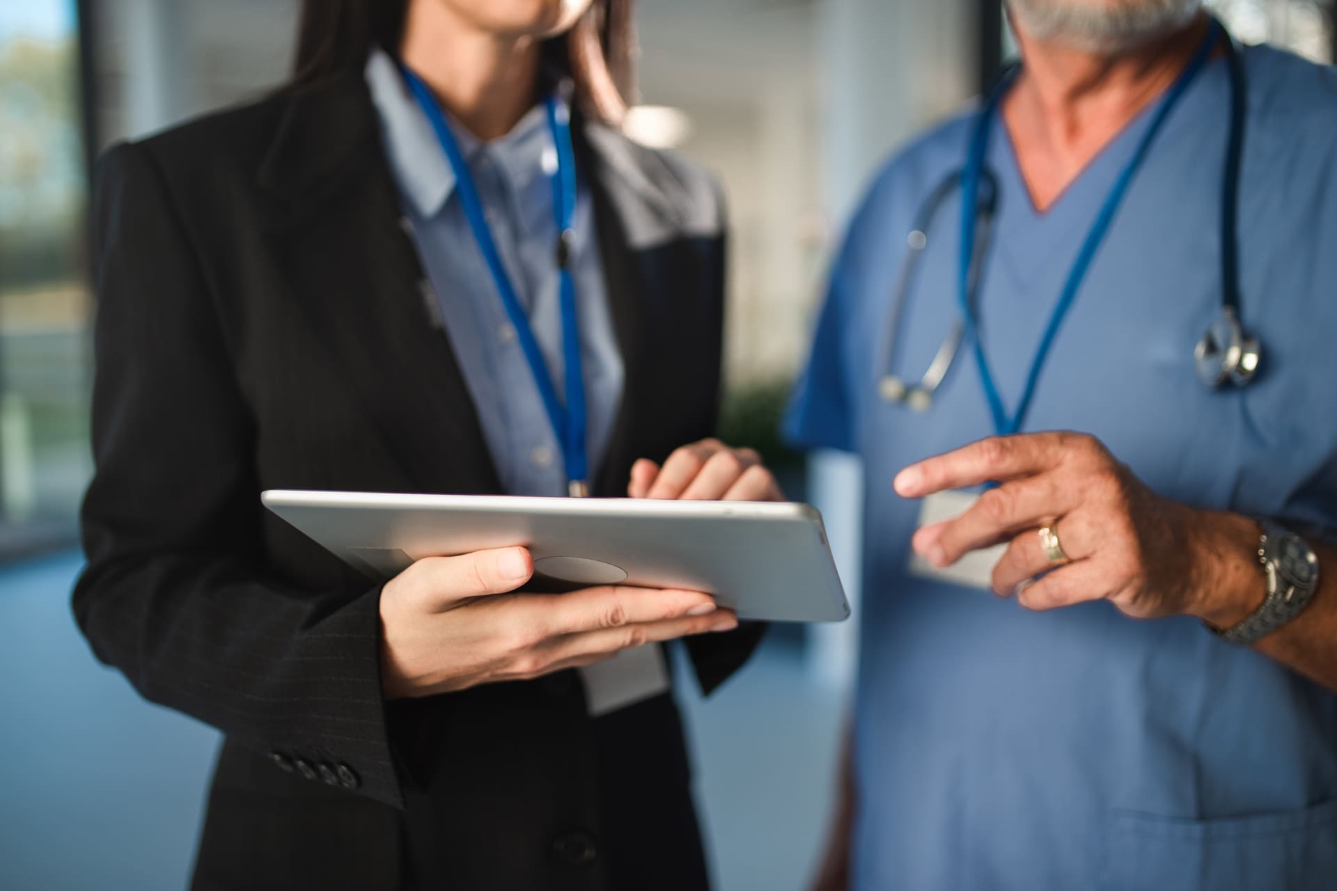 close-up-of-young-pharmaceutic-seller-explaining-something on tablet | CMIT Solutions close-up-of-young-pharmaceutic-seller-explaining-something on tablet