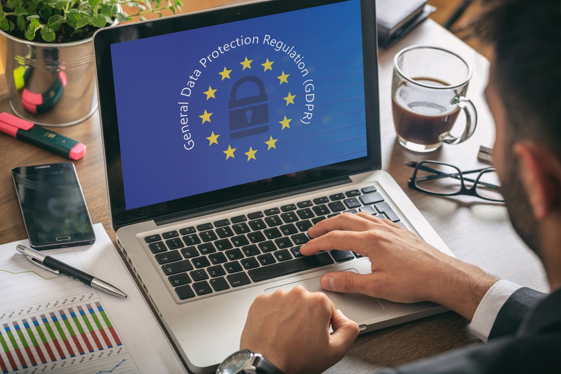 Person using a laptop displaying GDPR data protection graphic on screen | CMIT Solutions Person using a laptop displaying GDPR data protection graphic on screen