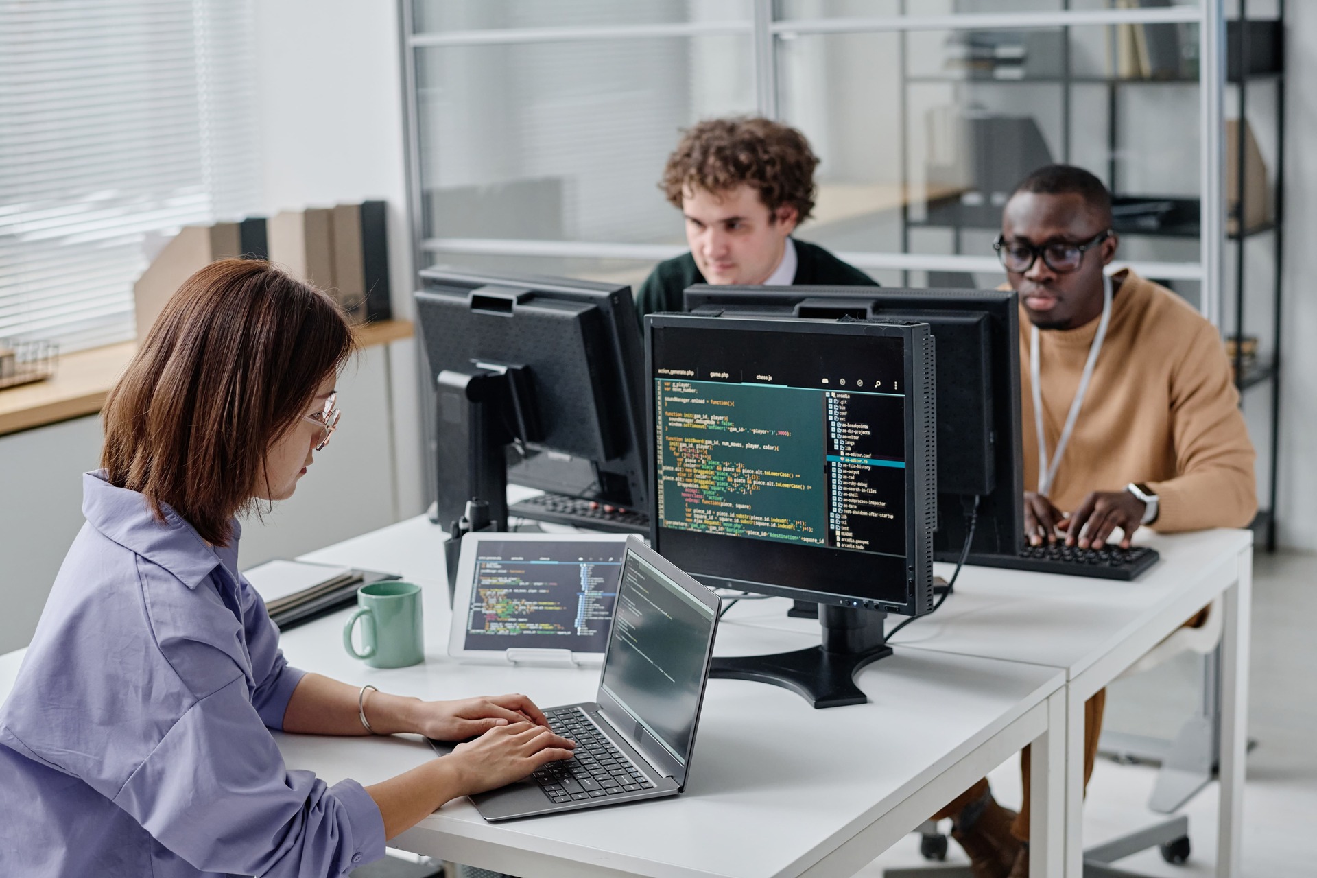 People working on computers in an IT office | CMIT Solutions People working on computers in an IT office
