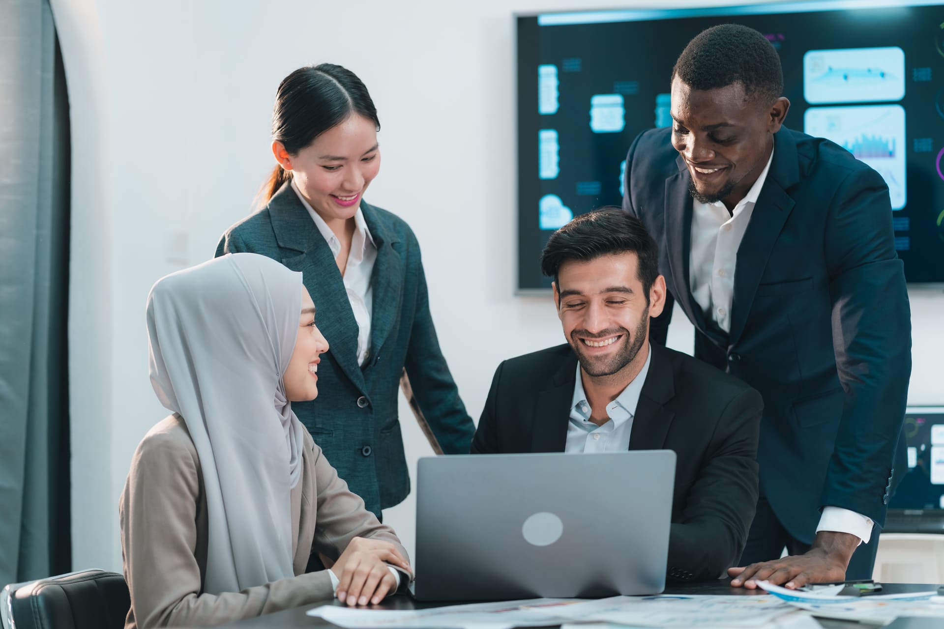 team-reviewing-data-on-a-laptop | CMIT Solutions team-reviewing-data-on-a-laptop