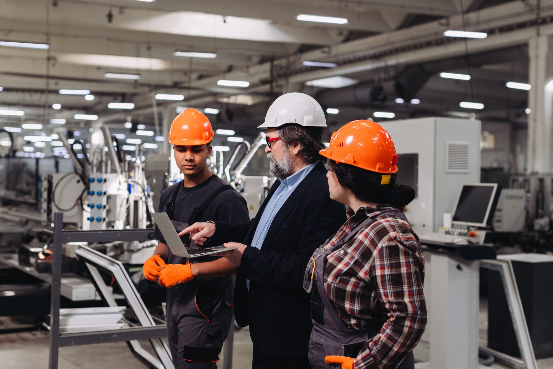 manufacturing-team-discussing-production-processes | CMIT Solutions manufacturing-team-discussing-production-processes