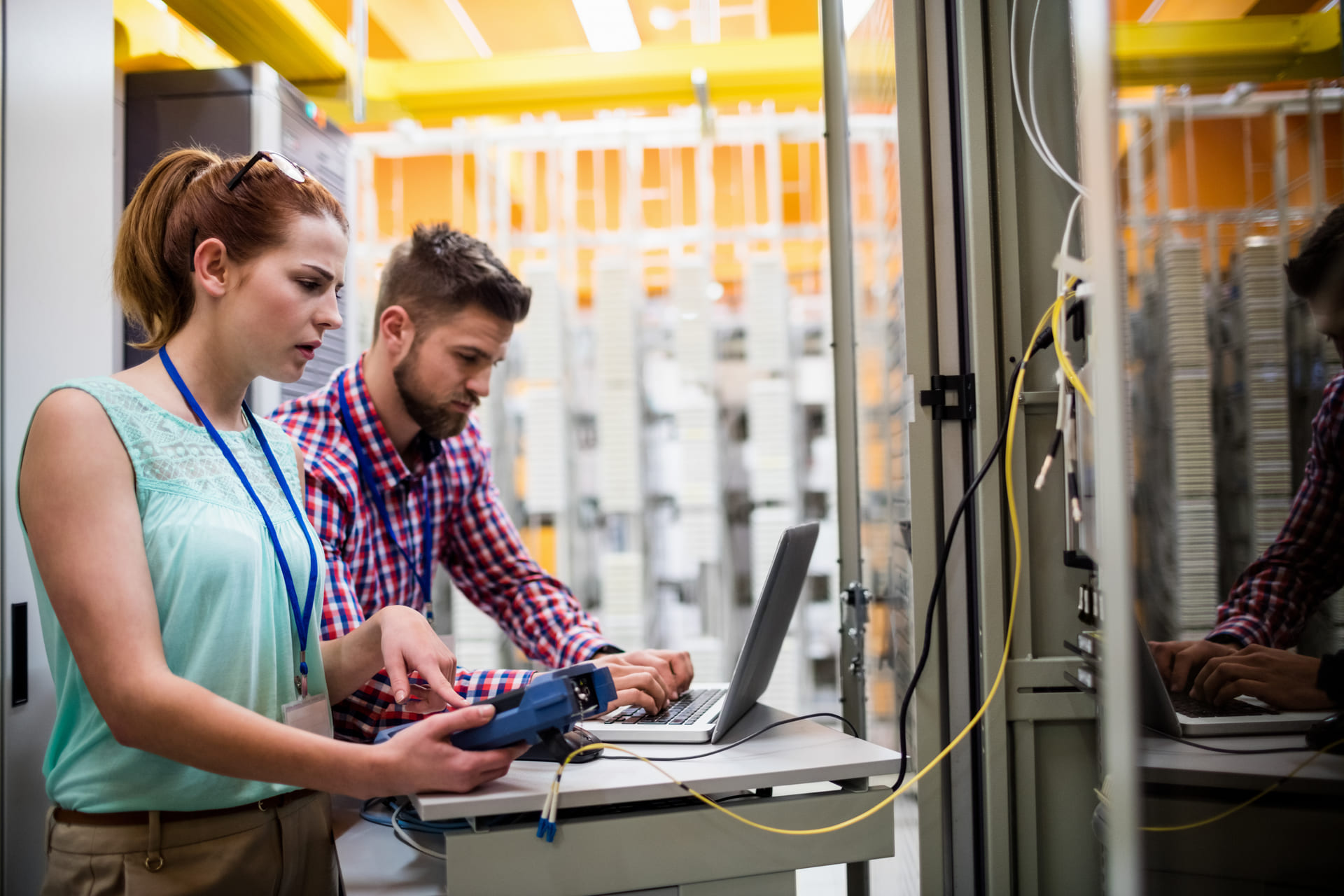 technicians-monitoring-servers-with-laptop | CMIT Solutions technicians-monitoring-servers-with-laptop