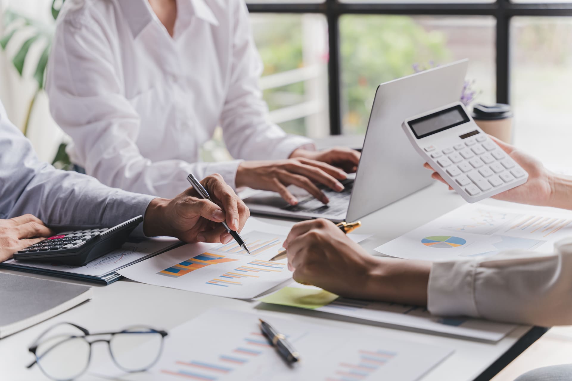 business-team-analyzes-financials-in-a-bright-office | CMIT Solutions business-team-analyzes-financials-in-a-bright-office