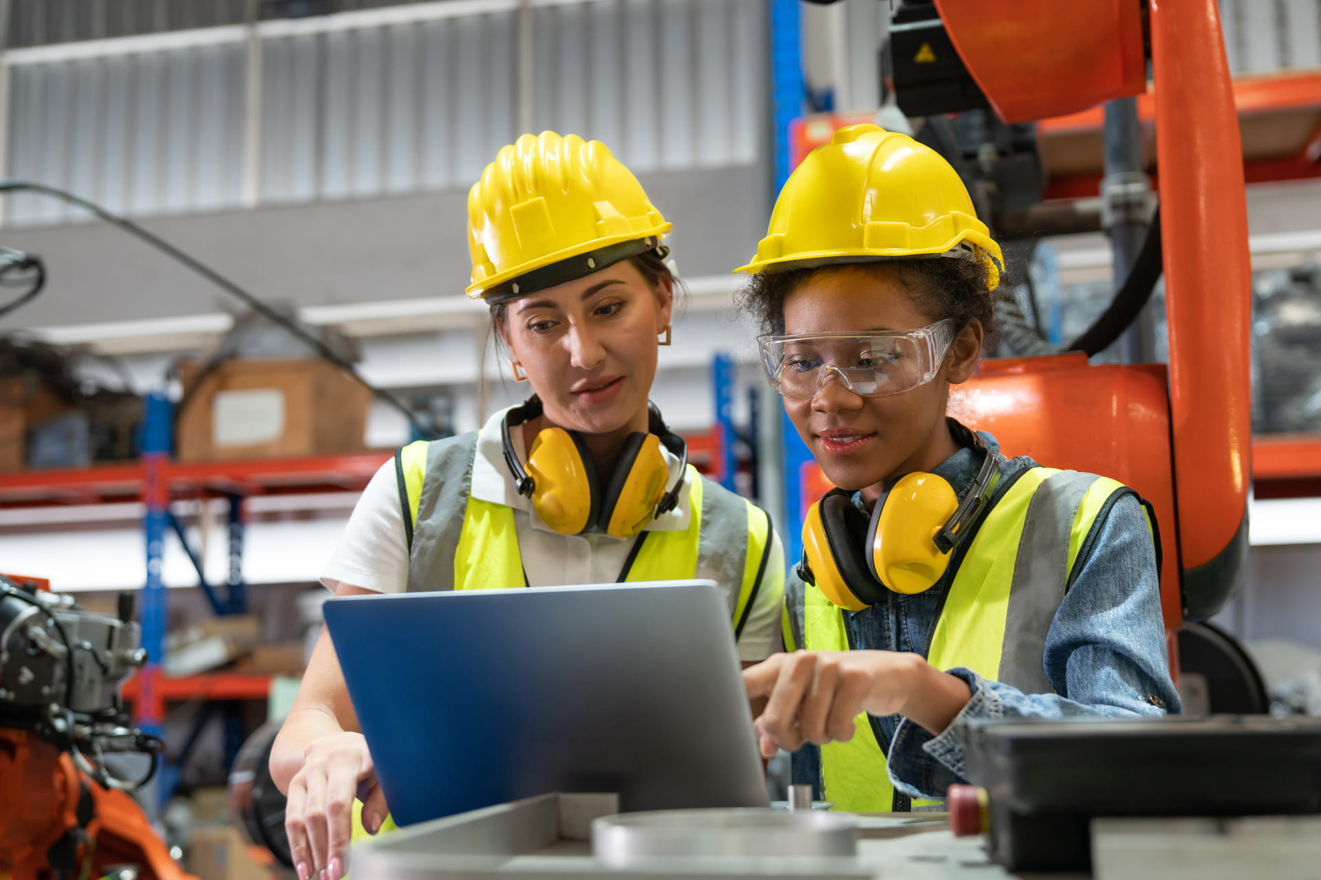 female-automation-engineers-using-laptop-for-inspection | CMIT Solutions female-automation-engineers-using-laptop-for-inspection