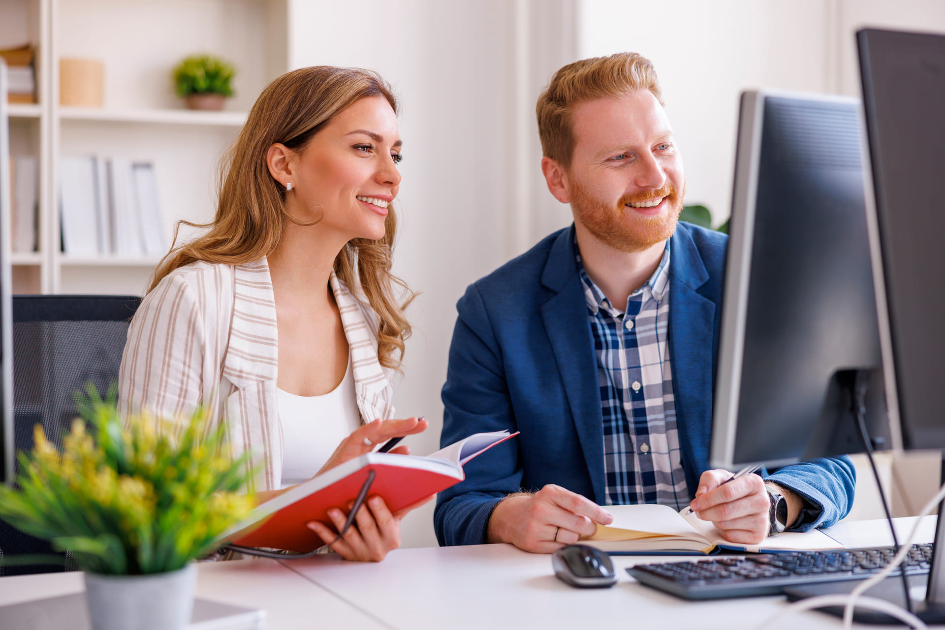 happy-coworkers-collaborating-on-project-in-the-office | CMIT Solutions happy-coworkers-collaborating-on-project-in-the-office