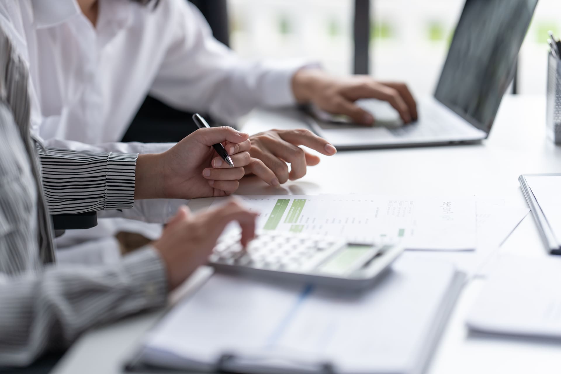 two-business-professionals-collaborating-on-financial documents | CMIT Solutions two-business-professionals-collaborating-on-financial documents