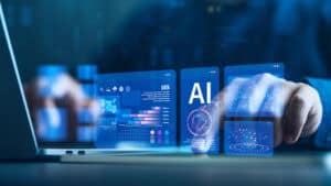 Businesspeople use computers and laptops to analyze AI-driven data in finance marketing big data advertising and UXUI etc to help solve problems faster and better | CMIT Solutions Hands interact with holographic AI dashboards projected above a laptop.