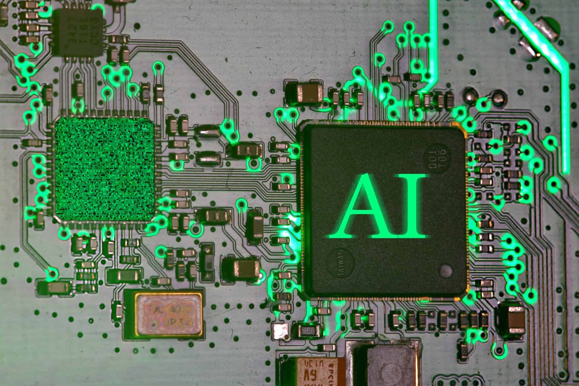 immo-wegmann-w69Z8K-HGQU-unsplash 1 | CMIT Solutions A microchip labeled AI sits on a circuit board illuminated by bright green electronic traces.
