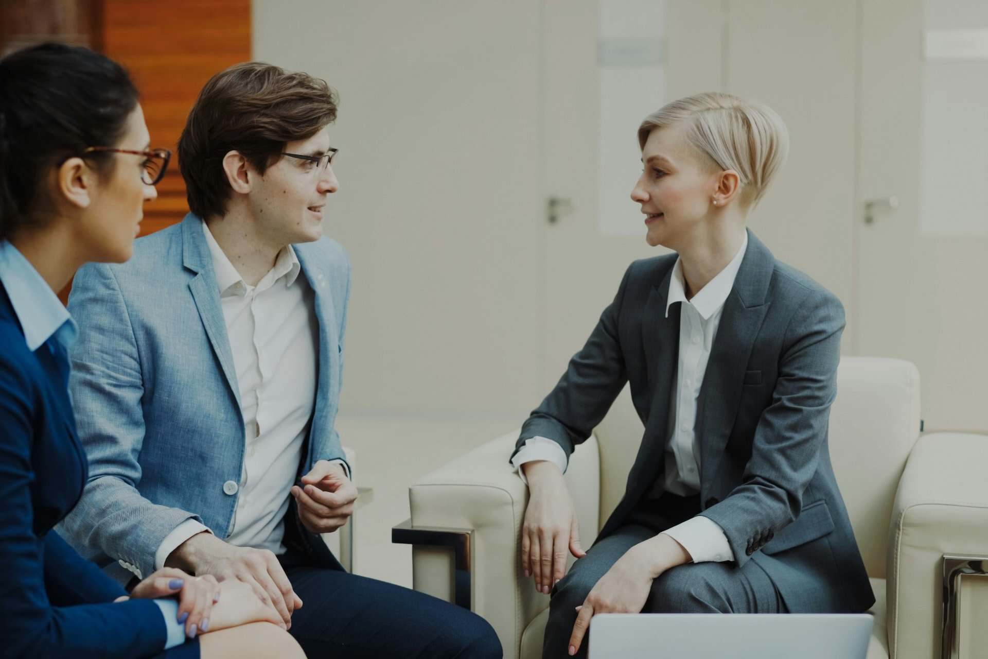 legal-consultation | CMIT Solutions Legal professional discussing a case with two clients during an office consultation.